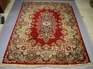A red and gold ground Wilton Persian style carpet with central medallion 454cm x 366cm w 