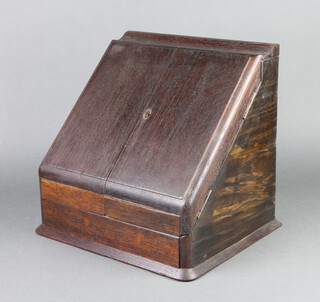An Edwardian oak wedge shaped stationery box with stepped interior, the base fitted a drawer 33cm h x 33cm w x 28cm d 