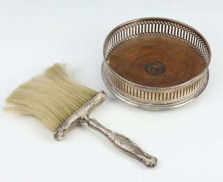 A silver mounted coaster with pierced decoration London 1986 13cm, together with a Sterling mounted brush 