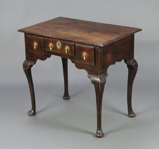 A 17th/18th Century oak lowboy fitted 1 long and 2 short drawers, raised on cabriole supports 74cm h x 80cm w x 53cm d