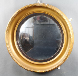 A 19th Century circular convex plate wall mirror contained in a gilt cushion shaped frame 56cm diam x 5cm d.  
