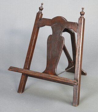 A 1930's Queen Anne style folding oak easel/book press with splat back and finials to the sides 56cm h x 49cm w x 45cm d 