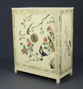 A 1930's white lacquered inlaid hardstone chinoiserie combination wardrobe/tallboy  fitted hanging space and 5 drawers enclosed by panelled doors inlaid birds amidst branches 127cm h x 102cm w x 51cm d  