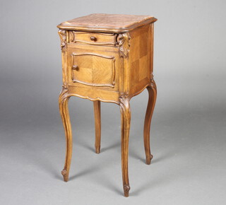 A French 19th Century carved walnut bedside cabinet of serpentine outline, the top set a pink veined marble top fitted a drawer with cupboard beneath, raised on cabriole supports 86cm h x 39cm w x 39cm d  