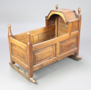 A 17th/18th Century style oak and elm rocking cradle of panelled construction 88cm h x 98cm w x 69cm d (possibly made up) 