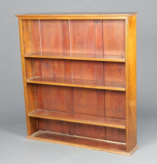An Edwardian rectangular mahogany bookcase with moulded cornice, fitted adjustable shelves 123cm h x 113cm w x 22cm d 