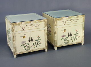 A pair of 1930's white lacquered and inlaid hardstone chinoiserie style bedside cabinets fitted a drawer above cupboard, decorated birds amongst branches 56cm h x 56cm w x 56cm d