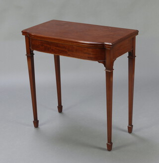 An Edwardian Chippendale style mahogany bow front card table raised on square tapered supports, spade feet 75cm h x 71cm w x 41cm d 

