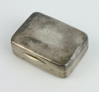 A George III silver rounded rectangular vinaigrette of plain form with engraved monogram and geometric pierced gilt grill, London 1808, maker I A, 33mm, 19.7 gram, together with a Tessiers Ltd box 