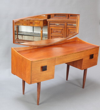 Kofod Larson for G-Plan, a teak  mid century dressing table fitted four drawers with shaped mirror 117cm h x 132cm w x 46cm d 