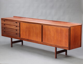 Archie Shine for Robert Heritage, a mid Century teak sideboard of two cupboards and 4 ribbed drawers 80cm h x 243cm w x 46cm d