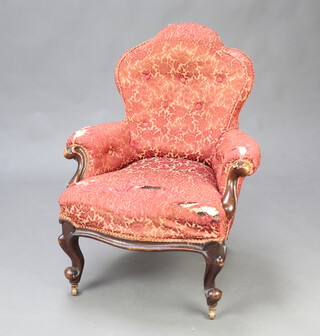 A Victorian metal framed armchair upholstered in red buttoned material, raised on cabriole supports 82cm h x 56cm w x 51cm d (seat 33cm x 33cm) 