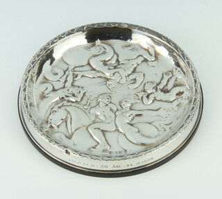 A Continental repousse silver mounted coaster decorated with classical figures 12cm 