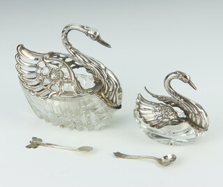 A silver mounted cut glass table salt in the form of a swan 10cm, ditto 7cm and 2 spoons 