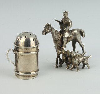 A Victorian silver miniature shaker 3cm and a Continental white metal group of a rider and 3 hounds 33 grams 