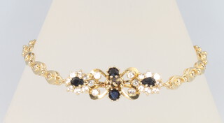A 14ct yellow gold sapphire and gem set bracelet 10.2 grams, 19.5cm