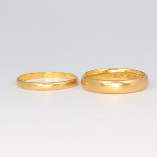 Two, 22ct yellow gold wedding bands, size M and and N 1/2, 6 grams