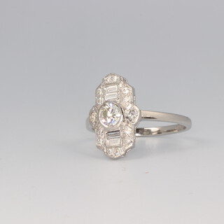 An Art Deco style platinum, baguette and brilliant cut diamond ring approx. 0.7ct, 4.9 grams, size O