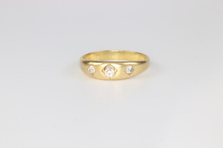 A yellow metal 3 stone diamond ring approx. 0.3ct, 4.8 grams, size S