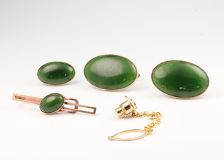 A pair of yellow metal jade cufflinks, a ditto tie stud and tie clip, gross weight 15.8 grams 