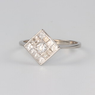 A platinum princess and brilliant cut diamond ring 0.7ct, size N, 2.7 grams 
