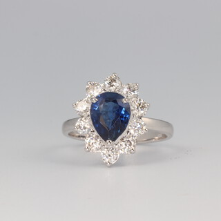 An 18ct white gold pear cut sapphire and diamond cluster ring, the centre stone 2.05ct, 10 brilliant cut diamonds 1.05ct, size N, 4.3 grams 