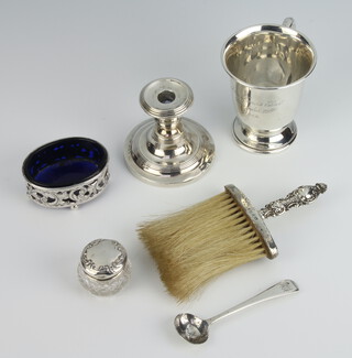 A silver Christening mug Birmingham 1913, a salt, a toilet jar, a brush and candlestick, 82 grams
