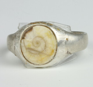 A silver and fossil signet ring (cut) 