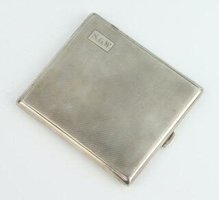 An Art Deco silver engine turned cigarette case with engraved inscription Birmingham 1931, gross weight 133 grams 