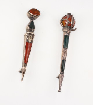 Two silver Scottish hardstone brooches in the form of a dirk and a sword