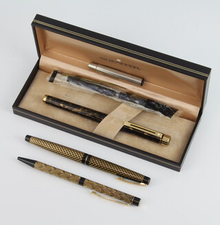 A Sheaffer black and gilt fountain pen with 14ct gold nib, a ditto with 15ct nib, together with a brown marbled fountain pen with 14ct nib complete with a box 
