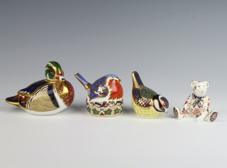 A Royal Crown Derby Carolina duck Imari paperweight with gold stopper 8cm, a ditto bird 8cm, a robin nesting 8cm, a seated teddybear (no stopper) 7cm 