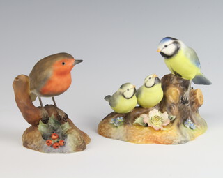 A Royal Crown Derby figure of a robin 9cm, ditto blue tit and chicks 10cm 