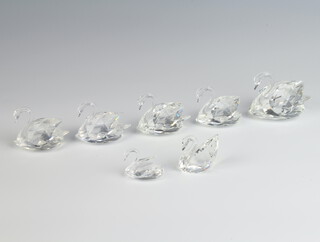 A Swarovski Crystal figure of a swan 5cm, 4 others 4.5cm, a ditto 4cm and 1 other 3cm 