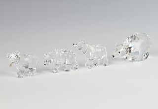 A Swarovski Crystal figure of a standing bear 5cm, a ditto with a fish in its mouth 4.5cm, a walking ditto 3.5cm and a standing ditto 5cm 
