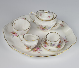 A Royal Crown Derby, Derby Posies miniature tea set comprising tray, teapot, sugar bowl, cream jug, tea cup and saucer