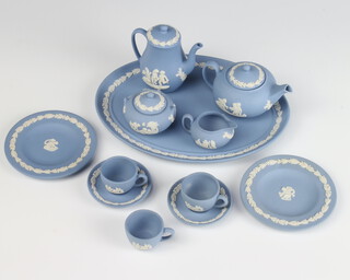 A Wedgwood blue Jasper miniature tea set comprising tea pot, coffee pot, 3 cups, 2 saucers, a sugar bowl, cream jug and 2 plates