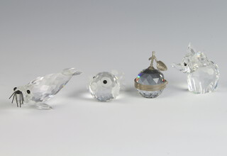A Swarovski Crystal figure of a seal 2cm, an apple 4cm, a blowfish 2cm and an elephant 5cm 