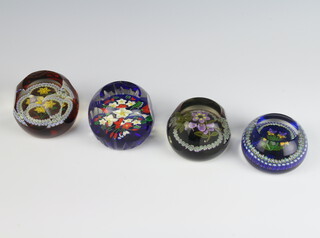 A Perthshire paperweight with multi colour canes enclosing flowers 7cm, a Caithness ditto, a Whitefriars Festive Delight 8cm, a ditto Spring 1997 by Nick Boyes 7cm and another limited edition 7cm 
