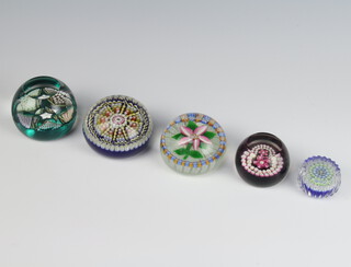 A Purcia multi cane paperweight with faceted sides 4cm, a Caithness miniature rose ditto 5cm, a Limited Edition Edinburgh paperweight no 248/250 7cm, a Purcia multi cane paperweight with butterfly 8cm and a multi cane floral paperweight 7cm 