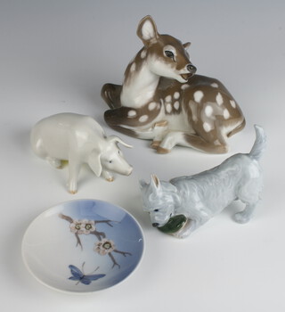 A Royal Copenhagen figure of a reclining faun 12cm, a ditto of a pig 6cm, ditto West Highland Terrier 9cm and a dish 9cm 