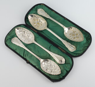 A cased pair of silver plated lily pattern berry spoons, 1 other pair 