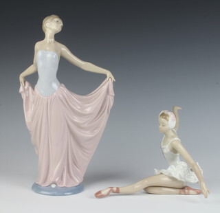 A Lladro figure of a lady holding her skirt 5050 29cm together with a seated ballerina 15cm, boxed 
