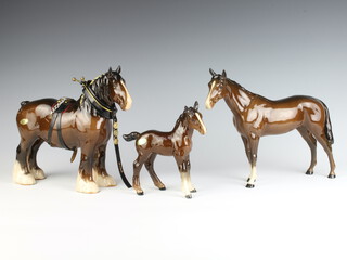 A Beswick figure of a standing shire horse, brown gloss 818, modelled by Arthur Gredington 28cm, ditto of a large racehorse brown gloss 1564 29cm and a ditto shire foal, brown gloss 951 15cm 