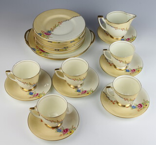 A Royal Doulton Rosalee pattern tea set comprising 5 tea cups, 6 saucers, 12 side plates, 2 serving plates and a milk jug 