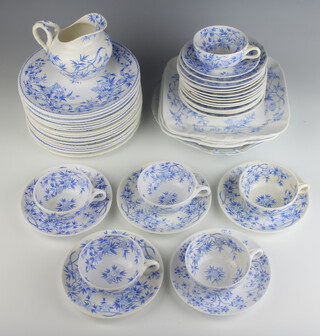 A Continental blue and white transfer print tea set comprising 6 tea cups, 20 mixed saucers, 17 medium plates, 4 serving plates and a milk jug 