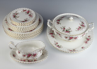 A Royal Albert Lavender Rose part dinner service comprising 6 dinner plates, 6 medium plates, 5 small plates, an oval meat plate, sauce boat and stand, lidded tureen 