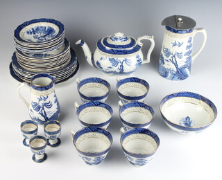 A Booths Old Willow pattern tea service comprising teapot, 6 tea cups, 7 saucers, 9 small plates, 6 medium plates, 1 large plate, a hot water jug, a milk jug, sugar bowl and 3 egg cups