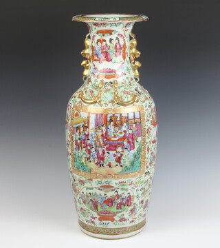 A 19th Century famille rose oviform vase decorated with a seated gentleman and figures in attendance in a pavillion setting with panels of figures insects and flowers on a ground of scrolling flowers and insects having gilt dragon handles 62cm h 