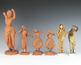 A 19th Century Indian earthenware figure of a standing dancing lady raised on a circular base 35cm, 2 small ditto raised on square bases 20cm, ditto of a standing gentleman 22cm and a pair of figures of a standing beggar and a lady raised on square bases 24cm 